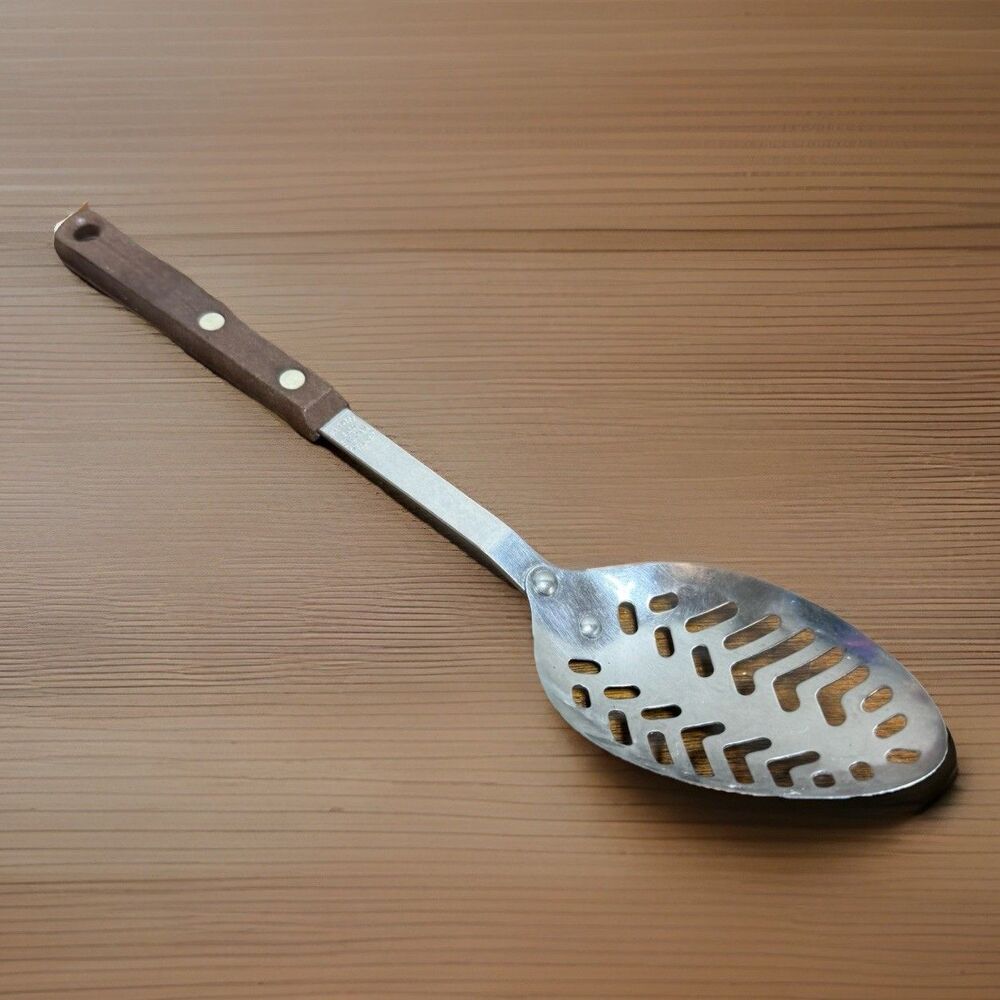 Ekco Eterna Stainless steel cooking spoon pierced vintage Bakelite handle